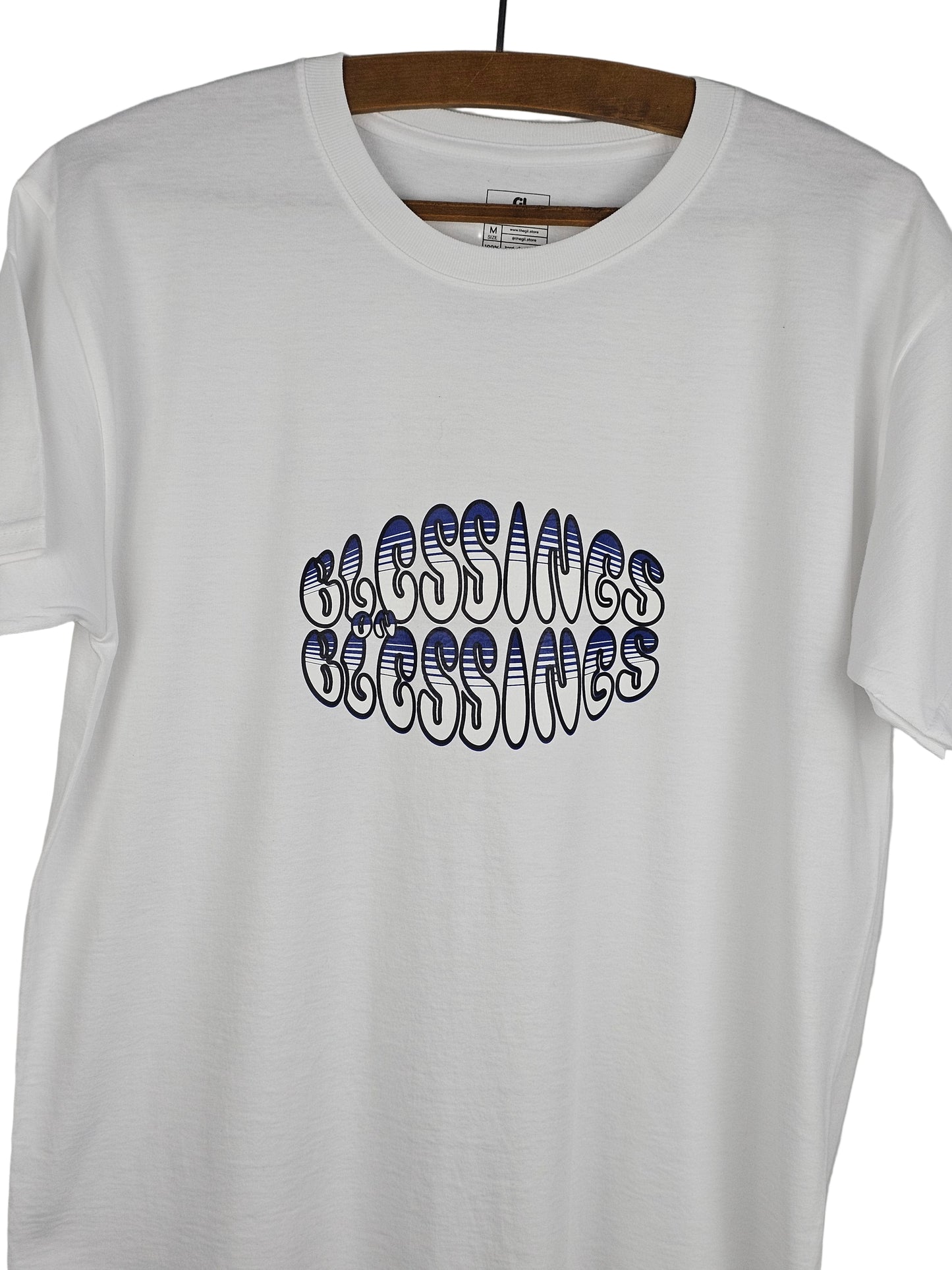White t-shirt with 'Blessings on Blessings' text design on a white background