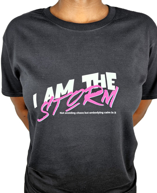 Black t-shirt with 'I AM THE STORM' text in white and pink on a plain background